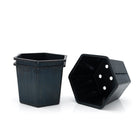Plastic free planters stacked together and one lying down. 