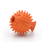 Orange rubber fish-shaped ball with spiky texture on a white background