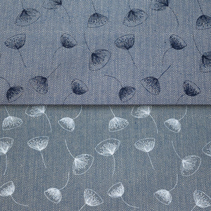 A close-up of fabric with a fine herringbone texture, featuring a floral pattern. The top half shows dark blue flowers, while the bottom half shows white flowers.