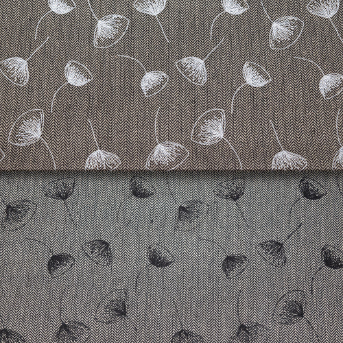 A close-up of fabric with a fine herringbone texture, featuring a floral pattern. The top half shows dark blue flowers, while the bottom half shows white flowers.