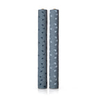 Two rolls of blue fabric standing up against a white background. Each roll has the same flower pattern, with one having blue flowers, and the other having white. 