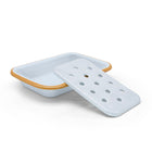 White enamel soap dish and holder with yellow rim. 