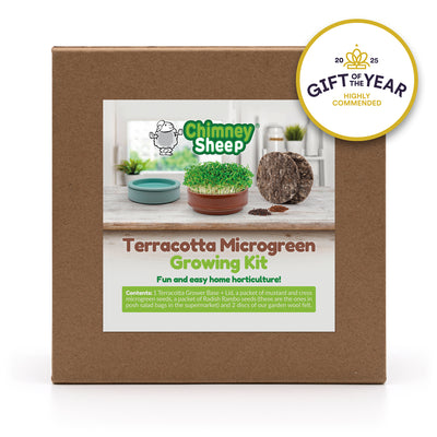 terracotta microgreen grower growing cress on a wooden surface, with a 'Gift of the Year' award badge in the corner.