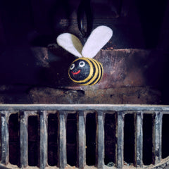 woolly felted bee dangle in fireplace thumbnail