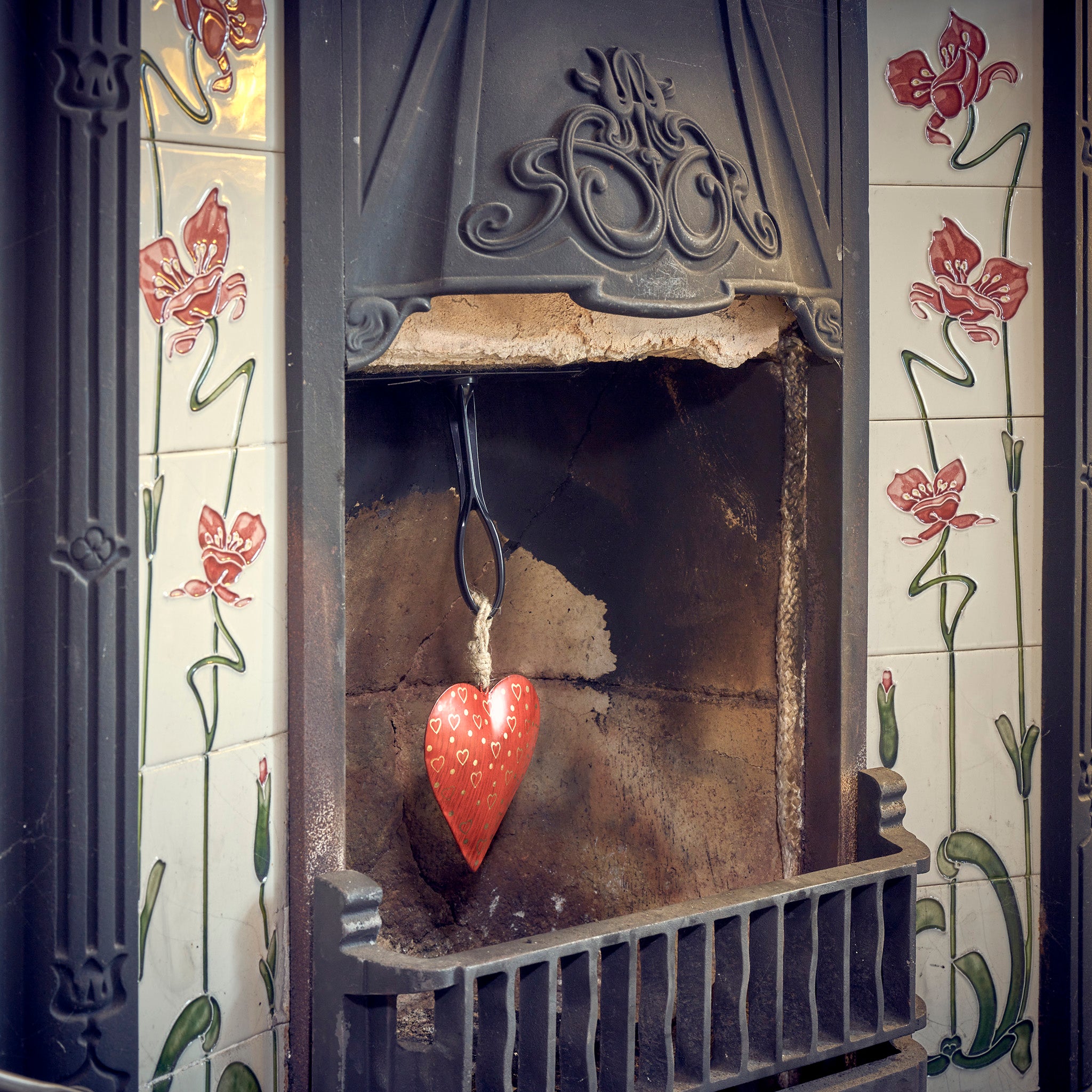 Namaste red metal heart in fireplace