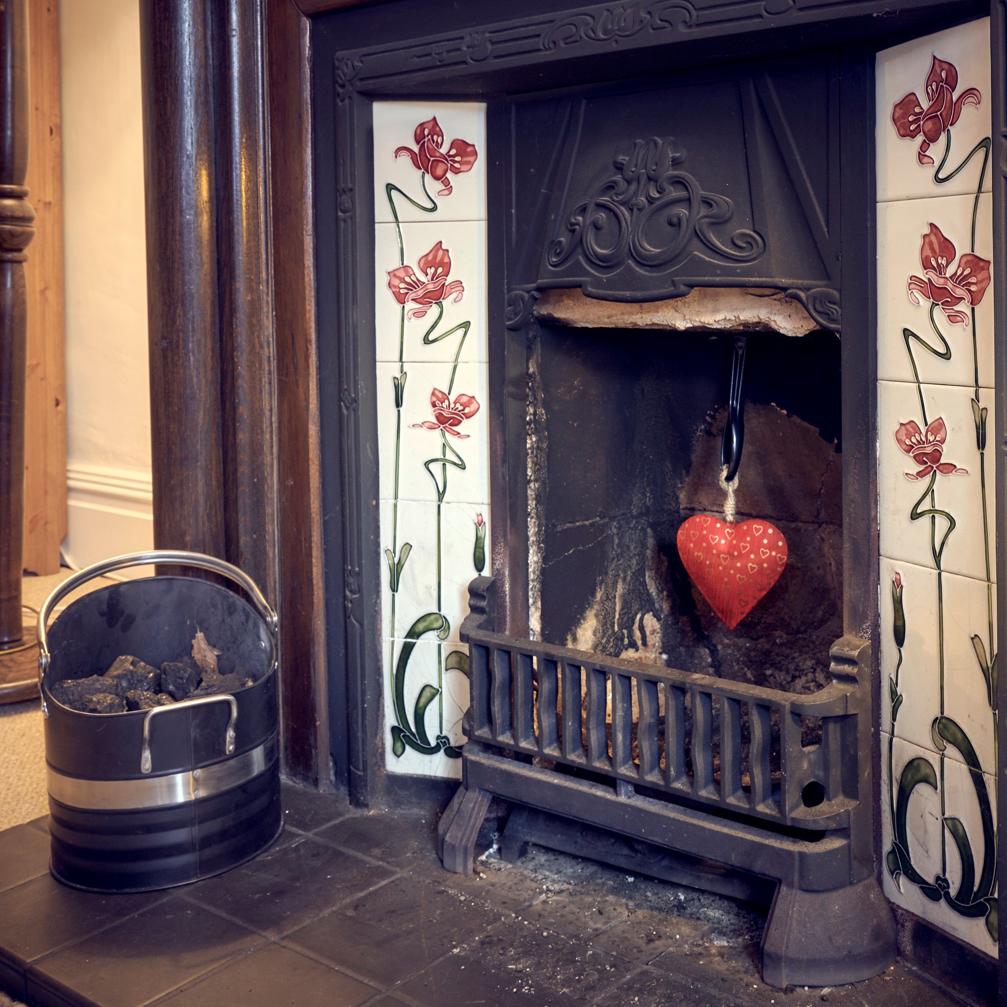 Namaste red metal heart in fireplace