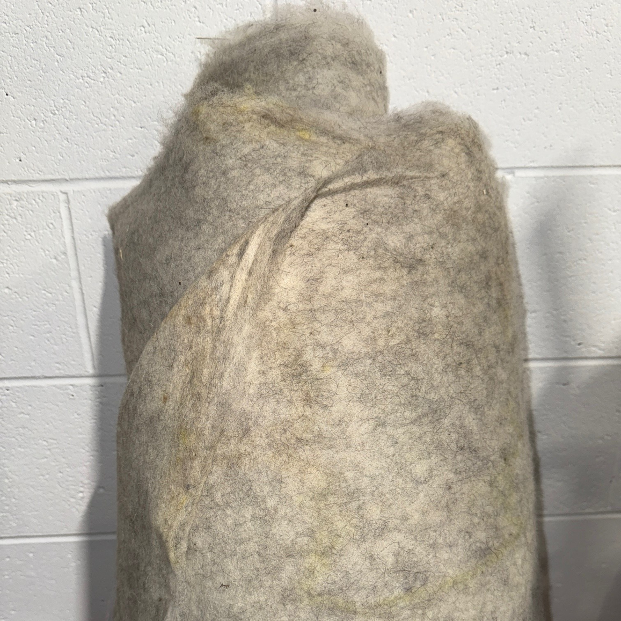 Sheep wool garden fleece slightly damaged.