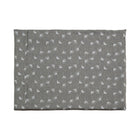 A Chimney Sheep Luxury felted wool dog bed. The bed is large and rectangular. This luxury wool dog bed is placed onto a white background. The organic cotton cover is patterned. The pattern is grey with white flowers.