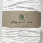 White yarn ball with a 'jolly good yarn' label on a gray background