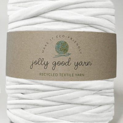 Red yarn ball with a beige label on a white background