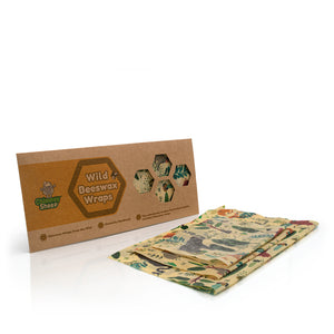Wild Beeswax Wraps by Chimney Sheep, featuring a brown kraft paper box and three reusable beeswax wraps with colorful botanical and animal patterns on a white background