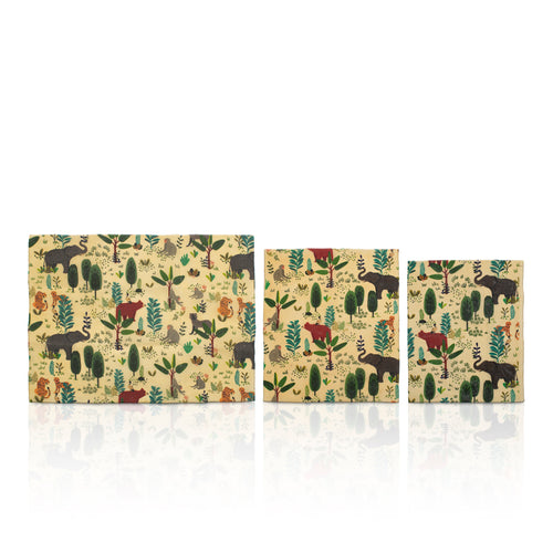 Wild Beeswax Wraps by Chimney Sheep, featuring a brown kraft paper box and three reusable beeswax wraps with colorful botanical and animal patterns on a white background