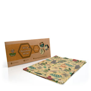 A pack of Beeswax Wraps from Chimney Sheep, showing the brown kraft paper packaging and a single reusable beeswax wrap with a colourful wildflower and animal pattern on a cream background.