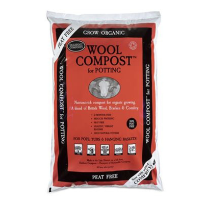 A bag of Wool Compost for Potting, featuring a red and black label on a white background.