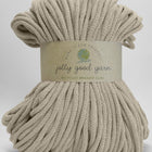 A large bundle of beige braided cord yarn wrapped with a paper label that reads 'jolly good yarn' and 'RECYCLED BRAIDED CORD' on a light grey background.