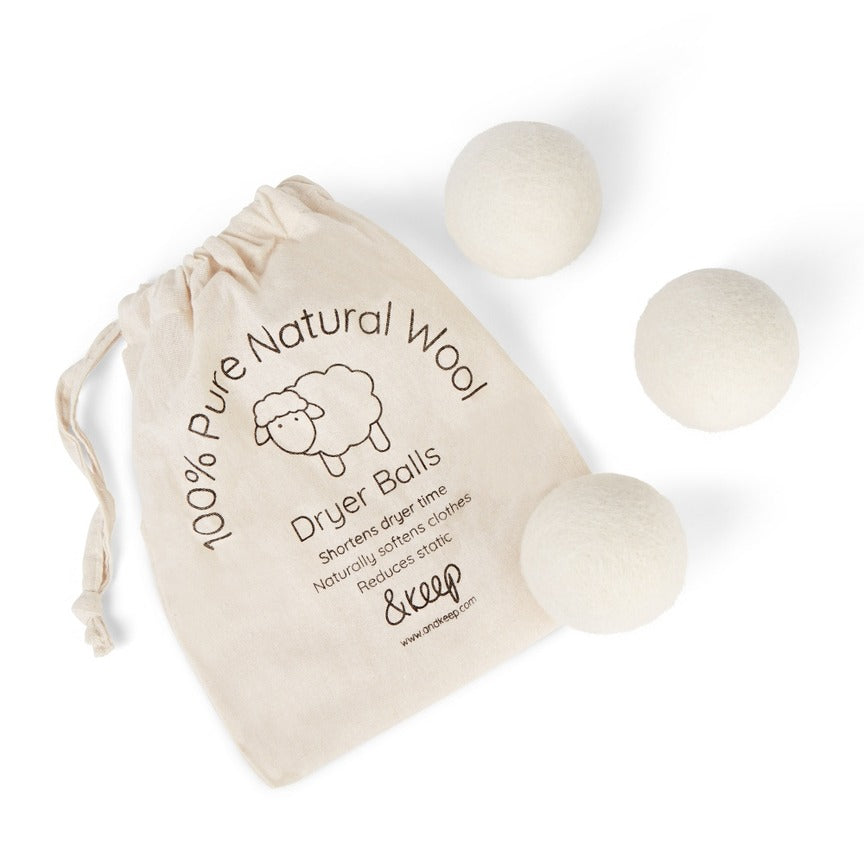 100% Natural Wool Dryer Balls out of packaging on a white background