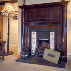 A medium wool chimney draught excluder for an open chimney - ready to be inserted into the chimney flue.