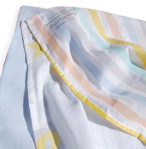 3 folded organic cotton muslins with different designs