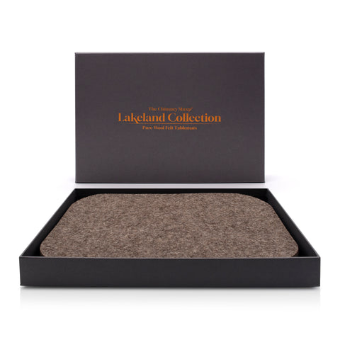 The lakeland collection, pack of four luxury grey sheep's wool tablemats. Both grey box and tablemats are placed on a white background