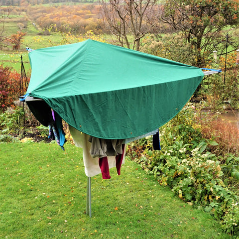 Laundry Mac is hung over laundry to protect it from rain showers and let it dry outside