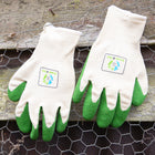 Pair of gardening gloves with green fingertips on a wooden surface